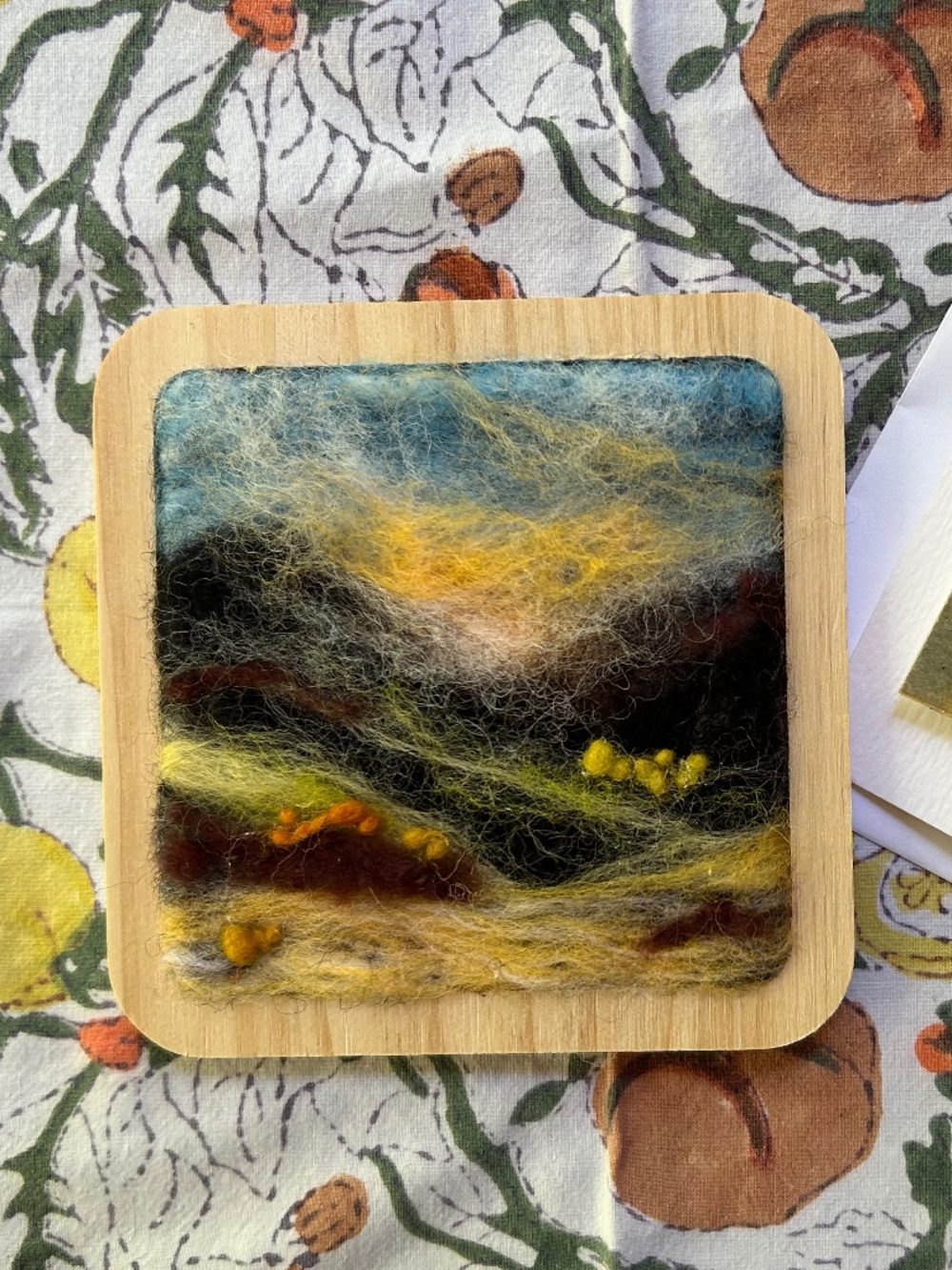 NWT “Hillside"  is a handmade/handcrafted wool painting with matching brooch